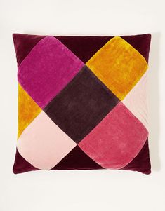 a multicolored pillow on a white background