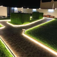 an outdoor area with grass and lights