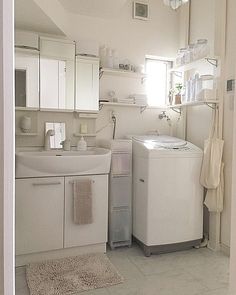 a kitchen with a washer and dryer sitting next to each other