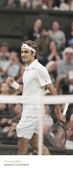 a man holding a tennis racquet on top of a tennis court with people watching