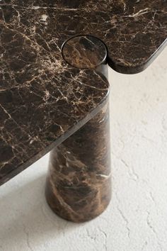 a marble table with two pieces missing from it