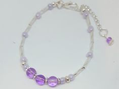 "Purple Beaded Bracelet/ *FREE SHIPPING*/ Birthstone Jewelry/Silver Jewelry/ Hypoallergenic/Nickel-Free jewelry/Gifts for her Handmade Jewelry Designs by WEEDs is handmade and created using high-quality materials designed to last. One Of A Kind Jewelry Pieces and more! Jewelry hypoallergenic nickel free gifts for her! Beautiful Purple Beaded Bracelet. Unique, with glass silver bugle beads and purple Czech glass beads. Also embellished with silver metal beads and a charming dangle bead charm. Thi Silver Hypoallergenic Stretch Bracelet For Healing, Silver Hypoallergenic Stretch Bracelet, Adjustable Silver Beaded Bracelets For Healing, Handmade Adjustable Silver Stretch Bracelet, Handmade Silver Stretch Bracelet With Round Beads, Adjustable Nickel-free Purple Beaded Bracelets, Purple Beaded Bracelets, Nickel Free Jewelry, Handmade Jewelry Designs