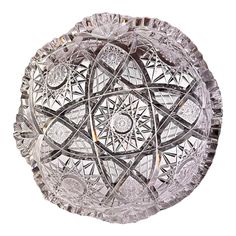 a glass bowl with an intricate design on it