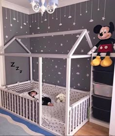 an image of a child's bedroom with mickey mouse on the wall