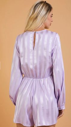 Surplice Knotted Romper-Lavender -Surplice v neck -Long sleeve -Button back closure 100% Polyester S/M/L Click below to complete this look Paired perfectly with Measurements (Approximate) Size Bust Waist Inseam Small 34" 28" 3" Medium 36" 30" 3" Large 38" 32" 3" Feminine Lavender V-neck Top, Fitted Lavender V-neck Blouse, Elegant Lavender V-neck Blouse, Feminine Lavender V-neck Blouse, Chic Mauve V-neck Top, Elegant Lavender Long Sleeve Top, Elegant Long Sleeve Lavender Blouse, Elegant Long Sleeve Lavender Tops, Lavender Long Sleeve Top For Party