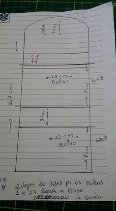 a piece of paper that is on top of a cutting mat with lines and numbers