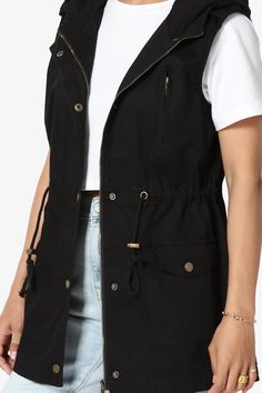 Channeling classic utilitarian styling, this cotton vest. Features a loose fit silhouette with a drawstring waist and flap patch pockets. Suitable for outdoor and sports wear, golf, hiking, climbing, traveling,riding, driving, walking, casual and other sports. Easy to wear with your favorite pants, skirt, leggings or shorts,suitable for a variety of occasionsSleeveless anorak vest : Stand-up collar with attached hoodedZip fly with snap button closure, Flap hand pockets, loose fitAdjustable draws Spring Casual Utility Jacket For Outdoor Activities, Cargo Pocket Vest For Outdoor Activities In Fall, Spring Utility Jacket With Pockets For Outdoor Activities, Outdoor Vest With Cargo Pockets For Fall, Fall Outdoor Vest With Cargo Pockets, Cotton Cargo Style Utility Jacket For Outdoor, Spring Outdoor Parka With Cargo Pockets, Utility Cargo Style Parka For Outdoor, Casual Outerwear With Drawstring For Outdoor Activities