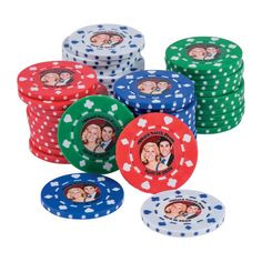 the poker chips are stacked on top of each other, with two faces painted on them