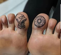 two people with tattoos on their feet and one has a donut tattooed on it