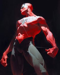 a red and white spider man standing in front of a black background with his hands on his hips