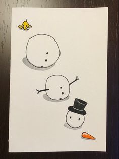 two snowmen with hats and carrots are depicted on a piece of white paper