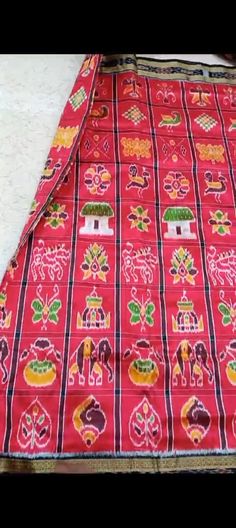 ### Red Nabakothi Handloom Silk Saree: A Timeless Treasure from Odisha #### Introduction Discover the elegance and tradition of the Red Nabakothi Handloom Silk Saree, a stunning piece of wearable art from the skilled weavers of Odisha. This saree is more than just a garment; it is a symbol of rich cultural heritage and impeccable craftsmanship. #### Origin and Craftsmanship The Red Nabakothi Handloom Silk Saree hails from the culturally rich state of Odisha, renowned for its exquisite handloom t Traditional Wear With Motifs For Festivals, Traditional Festival Wear With Motifs, Red Lehenga With Traditional Patterns For Puja, Red Handloom Traditional Wear For Ceremonial Occasions, Ceremonial Multicolor Traditional Wear With Patterns, Traditional Sets With Motifs For Festivals, Red Traditional Wear For Festivals, Red Traditional Wear For Ceremonies, Traditional Handloom Red Lehenga