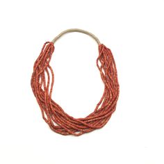 "Bohemian natural red coral multistrand beaded necklace with hemp. About 1.75\" wide and 30\" in length." Traditional Multi-strand Red Coral Necklaces, Traditional Multi-strand Red Coral Necklace, Orange Multi-strand Jewelry For The Beach, Orange Multi-strand Jewelry For Beach, Traditional Multi-strand Red Coral Beaded Necklace, Orange Hand-strung Multi-strand Jewelry, Orange Multi-strand Hand-strung Jewelry, Artisan Multi-strand Hand-strung Necklaces, Traditional Orange Multi-strand Jewelry