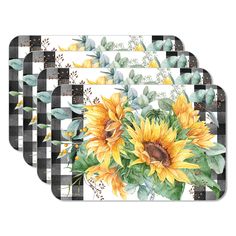 three placemats with sunflowers and greenery on the top one is black and white checkered