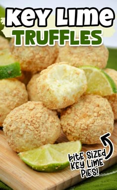 key lime truffles on a cutting board with lime wedges in the middle