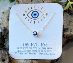 "Wear this lovely evil eye necklace as protection from the evil eye curse.  The evil eye is a malicious glare given to someone out of spite, malice, or envy, usually directed towards someone unaware of it.  The glare is considered to bring misfortune, suffering, or just general bad luck, so the evil eye talisman was created to wear for protection against this and to bring good luck.  This pretty glass evil eye charm floats along a dainty, shimmering chain and is double-sided, so the charm is visible from both sides. The charm is cylindrical, not flat, which really makes the evil eye amulet stand out.  The gold chain is delicate in appearance, but strong enough for everyday wear.  Wear your evil eye necklace alone as a lucky talisman statement piece or layer it with others. I suggest about Symbolic Evil Eye Charm Necklace As Gift, Symbolic Evil Eye Charm Necklace For Gift, Adjustable Evil Eye Spiritual Necklace, Nazar Necklace, Gold Plated Evil Eye Amulet Necklace, Evil Eye Amulet Pendant Charm Necklace, Rose Gold Heart Necklace, Gold-plated Evil Eye Amulet Necklace, Pearl Charm Necklace