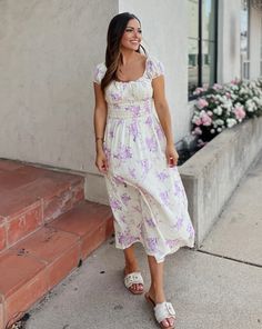 Get ready to bloom in style with the Sophie Lavender and Cream Floral Gauze Midi Dress. Designed with comfort in mind, this dress can be effortlessly paired with sandals for a chic and relaxed look all summer long. Beat the heat without compromising on style! Product Details: Features: Smocked back. Elastic puff sleeves. Lined. Fit: True to size. Model is 5'3 and wearing a size small. Fabric: Care: SIZING DETAILS: There is not a universal size chart that will apply to every item and person becau Purple Dresses, Athletic Accessories, Winter Tops, Beat The Heat, Watch Live, Autumn Summer, Puff Sleeves, The Heat, Set Dress