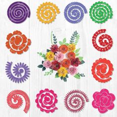 paper flowers are arranged in different colors