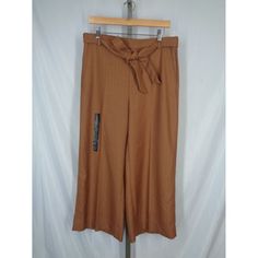 Banana Republic Rowan Wide-Leg Crop Pants--New Retail $69.99 Size 12 (Measurements Below) Brown Herringbone Elastic Waistband In Back Removable Matching Tie Belt Front Slant Pockets Pull-On Style 73% Polyester, 25% Rayon, 2% Spandex Machine Wash Approximate Measurements Laid Flat: Waist Unstretched: 16-1/2" Rise: 12-1/2" Hips: 20-3/4" Inseam: 24" Leg Opening: 12-3/4" Wide-leg Workwear Bottoms With Tie Waist, Wide-leg Workwear Pants With Tie Waist, Workwear Wide-leg Pants With Tie Waist, Wide-leg Tie Waist Pants For Work, Fall Wide Leg Pants With Tie Waist, Workwear Bottoms With Tie Waist And Long Pants, Brown Wide Leg Pants For Spring, Tie Waist Long Pants For Workwear, Spring Workwear Bottoms With Tie Waist