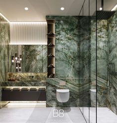 a bathroom with green marble walls and flooring