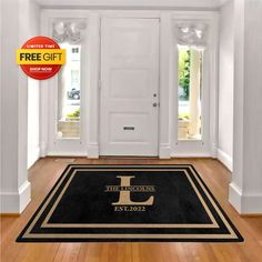 a door mat with the letter j on it in front of a white door and wooden floor