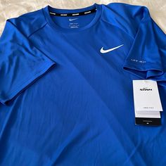 Brand New. Never Worn. Tags Attached. Nike Swim Tee Shirt. Short Sleeve. 100% Polyester With Upf 40+ Protection. Super Fast Line Dry. Generous Medium Fit. Armpit To Armpit 22”. Length 28”. Royal Blue. Swim Tee Shirts, Nike Compression, Shirts Nike, Mens Fade, Nike Swim, Dri Fit Shirt, Team Apparel, Blue Nike, Nike Tees