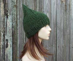 "Style: Gnome style pointy hat. Color: This sample hat is shown in Evergreen. Sizes: One size fits average teen or adult head size of 20\" to 23\" (50.5 cm to 58 cm). Fiber Content: 80% acrylic, 20% Wool Characteristics: Chunky, very soft, warm and cozy. Care Instructions: Hand wash, dry flat. Every item from Pixiebell is handmade and knit or crocheted to order, unless otherwise stated in title of the item as \"ready to ship\". Production time may vary, please check the SHIPPING & POLICIES t Gnome Hat, Chunky Knit Hat, Mens Hat, Pixie Hat, Handmade Knitwear, Womens Hat, Elf Hat, Garden Gnome, Pattern Store