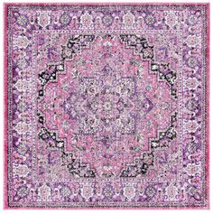 a pink and purple rug with an ornate design