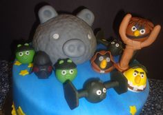 a cake with angry birds and other cartoon characters on it