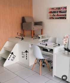 a desk with two chairs and one chair sitting on top of it