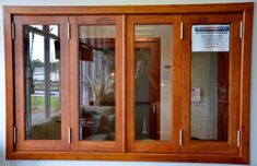 a wooden window with glass panels on the outside