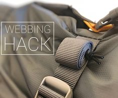 the webbing has been placed on top of an unzipped backpack