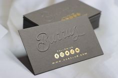 two business cards sitting on top of each other with the word berry written in cursive writing