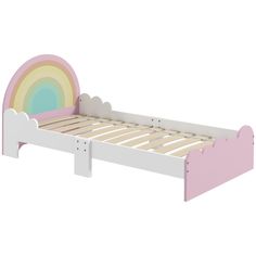 a white wooden bed with pink and green trimmings on the headboard is shown