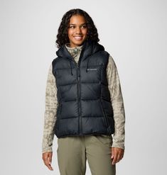 A versatile hooded puffer vest built to take on cold in comfort and style. Hooded Puffer Vest, Hiking Jacket, Youth Shoes, Suit Shoes, Columbia Jacket, Body Warmer, Sportswear Brand, Soft Shell Jacket, Casual Trousers