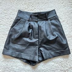 Brand New With No Tags Pair Of Cuffed Shorts From Topshop. Faux Leather, Really Soft And Realistic Feel Type Of Material. Usable Slanted Pockets As Well As Usable Back Pockets. Pleated Front. Size 4 Us, Uk 8. Measurements: Waist 14-14.5”, Rise 14”, Inseam 3”. Black Short Length Leather Pants For Night Out, Fitted Faux Leather Shorts For Workwear, Chic Black Leather Pants Short Length, Chic Short Leather Pants For Night Out, Chic Black Short Leather Pants, Chic Black Short Length Leather Pants, Leather Shirts, Leather Shirt, Cuffed Shorts