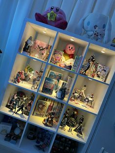 a book shelf filled with lots of toys