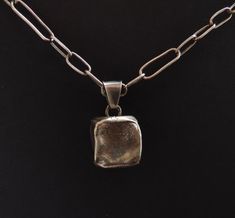 Silver cube necklace made of silver 925 . The dimensions of the cube is  0,59/0,59 inches ;  1,5/1,5 cm; .Color effect achieved by the process of oxidation. The jewelry is packed in a gift box-craft Pendant with chain 50 cm Minimalist Box Chain Pendant Jewelry, Minimalist Box Chain Jewelry As Gift, Minimalist Rectangular Box Chain Jewelry, Minimalist Handmade Rectangular Jewelry, Minimalist Box Chain Jewelry For Jewelry Making, Hand Forged Sterling Silver Necklace With Rectangular Pendant, Minimalist Oxidized Finish Jewelry Gift, Modern Sterling Silver Square Pendant Necklace, Modern Sterling Silver Necklace With Square Pendant