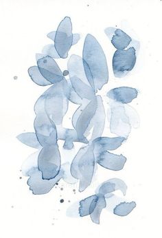 some blue watercolors are being used to create an abstract painting on white paper