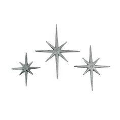 three metal stars on a white background