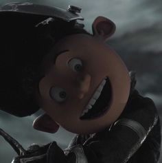 the animated character is smiling and holding his hand up to his face with an evil look on