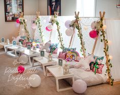 a room filled with lots of decorations and balloons