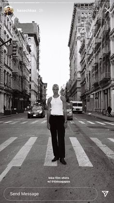 a man standing in the middle of an empty street