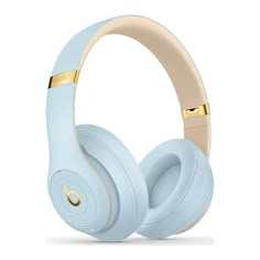 the beats by dr dre headphones are light blue with gold trimmings