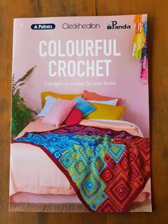 the cover of a book with colorful crochet on it's front page