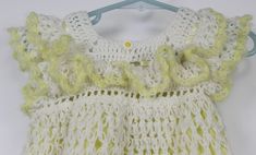 "Vtg 70/80's Handmade Crochet Dress Girls Sz 4 Daisy Flowers Lace Yellow White Yellow and white dress Empire waist with A-line silhouette Daisy flower accent buttons Crochet-knit outer layer Bodice is lined, lace stitched cap sleeves Normal wear Girl dress size 4 based on measurements Approx measurements: Armpit to pit: 11\" (28 cm) Total Length: 19\" (48 cm)" White Fitted Crochet Dress With Ruffles, White Crochet Dresses For Spring, Spring Cream Crochet Dress, White Vintage Crochet Dress For Spring, Vintage White Crochet Lace Dress, Vintage Sleeveless Crochet Dress For Spring, White Fitted Vintage Crochet Dress, Spring Yellow Crochet Dress, Crochet Dress Girl