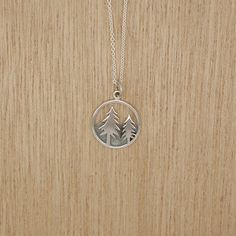 Recycled Sterling Silver Adventure Necklaces are the best way to remind ourselves where our happy place is. Beautifully handcrafted pendants can be worn alone or layered with other necklaces. Choose from: Dog Howling, Trees, Star Compass, Sky, Mountains, Waves. This pendant comes on a 18" Sterling silver chain. 18" Sterling Silver Cable Chain from US, Lead and Nickel Free. Recycled Sterling Silver Adventure Pendants made in Thailand Shipped from our studio in Oregon Handmade Holistic Round Pendant Necklace, Eco-friendly Adjustable Jewelry For Gift, Nature-inspired Round Pendant Jewelry For Crafting, Handmade Pendant Charm Necklace Nature-inspired, Handmade Nature-inspired Pendant Charm Necklace, Adjustable Nature-inspired Sterling Silver Necklace, Sterling Silver Everyday Necklace With Nature-inspired Style, Everyday Sterling Silver Nature-inspired Necklace, Everyday Nature-inspired Sterling Silver Necklace