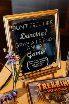 a sign that says don't feel like dancing grab a friend and a game