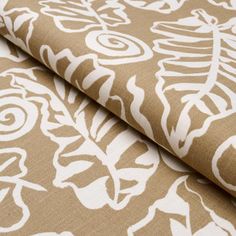 a close up view of a brown and white fabric with an intricate design on it