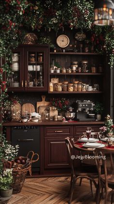 a kitchen with wooden floors and lots of greenery